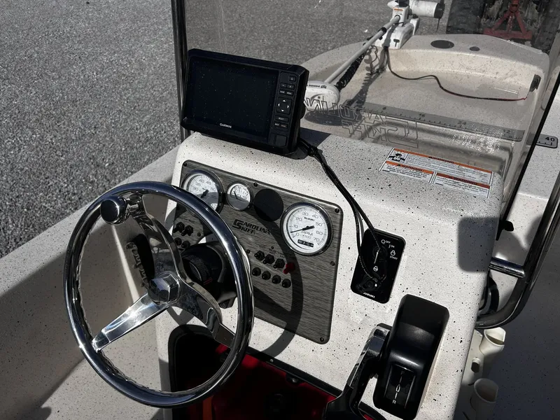 Slide: The Image of 2024 Carolina Skiff JVX18CC helm with Garmin display. - 8