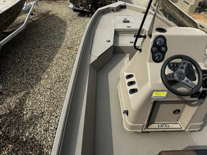 Slide: The Image of 2026 Excel 220 Bay Pro Elite boat cockpit view. - 8