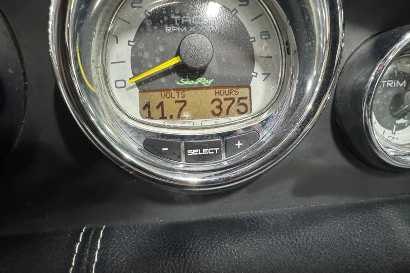 Slide: The Image of Close-up of 2011 Sea Ray SLX 250 gauge showing 11.7 volts and 375 hours. - 13