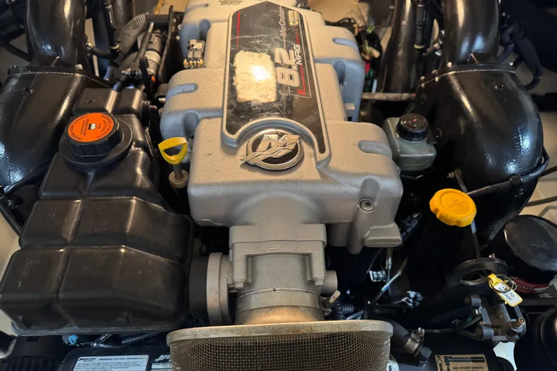 Slide: The Image of Engine of a 2011 Sea Ray SLX 250 boat, showcasing detailed components. - 14