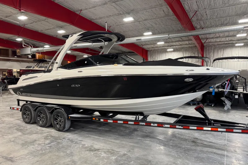 Slide: The Image of 2011 Sea Ray SLX 250 boat on trailer in indoor showroom. - 5