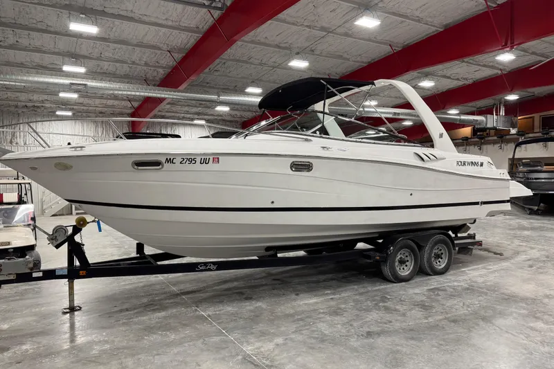 The Image of 2005 Four Winns 285 Sundowner boat on trailer in indoor storage facility. - 0