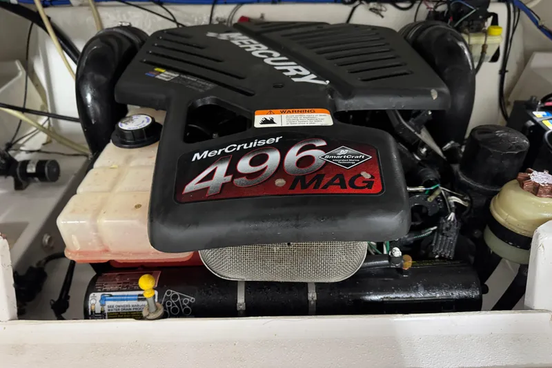 Slide: The Image of MerCruiser 496 MAG engine in 2005 Four Winns 285 Sundowner boat. - 13