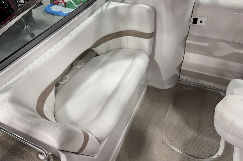 Slide: The Image of 2005 Four Winns 285 Sundowner interior with white seating and cup holders. - 7