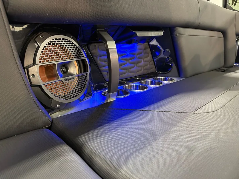 Slide: The Image of MasterCraft X24 2022 interior with speaker and blue lighting. - 21