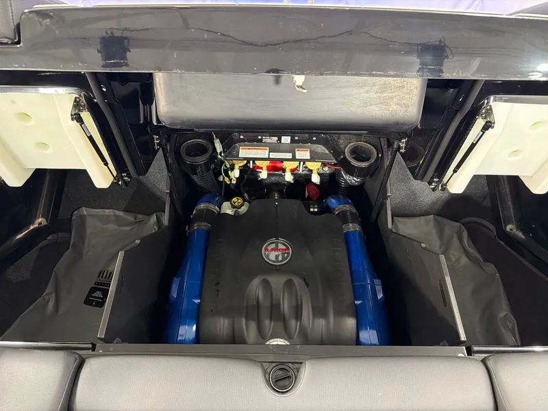 Slide: The Image of Engine compartment of 2022 MasterCraft X24 with blue engine block. - 23