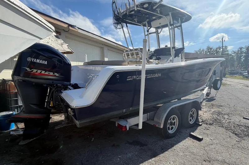 Slide: The Image of 2016 Sportsman Heritage 231 Center Console boat on trailer with Yamaha VMAX engine. - 2