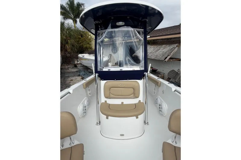 Slide: The Image of 2016 Sportsman Heritage 231 Center Console boat with tan seating and canopy. - 4