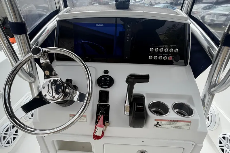 Slide: The Image of 2016 Sportsman Heritage 231 Center Console dashboard with steering wheel and controls. - 6