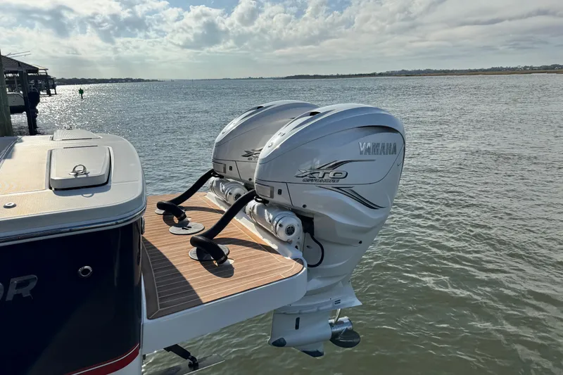 Slide: The Image of 2022 Regulator 34 interior storage compartment with equipment and wooden flooring. - 13