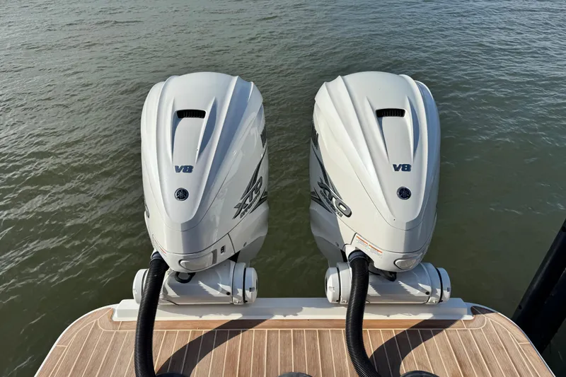 Slide: The Image of 2022 Regulator 34 boat interior with speaker, hose, and cleat. - 23