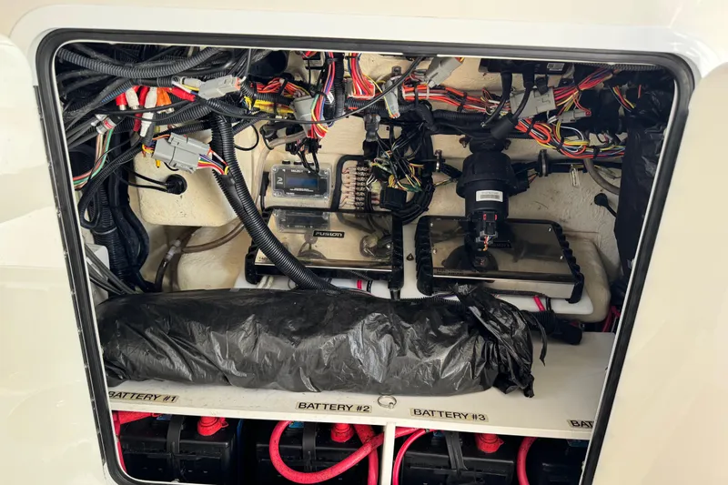 Slide: The Image of Control panel of 2022 Regulator 34 boat featuring Yamaha throttle and switches. - 25