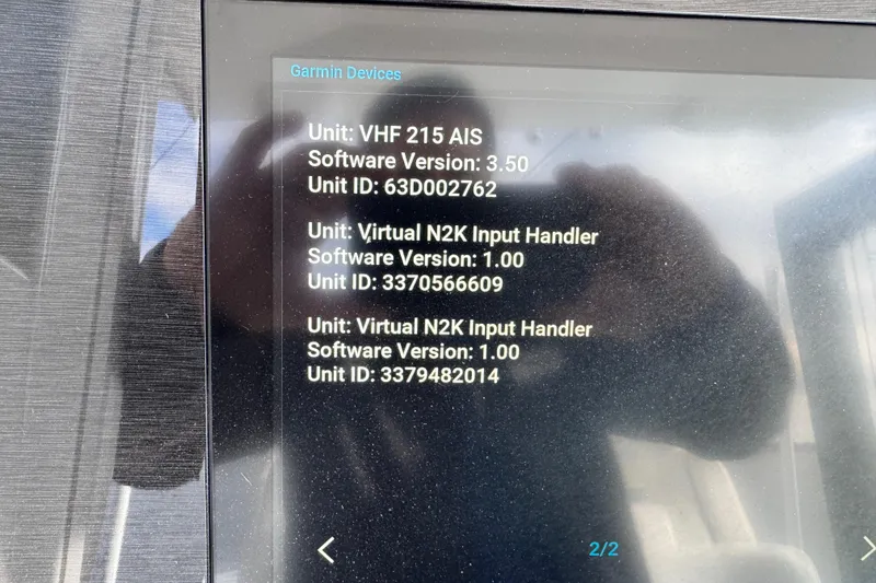 Slide: The Image of 2022 Regulator 34 boat interior with cup holders and sleek white design. - 30