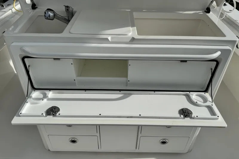 Slide: The Image of 2022 Regulator 34 boat dashboard with Garmin and Raymarine navigation displays. - 33