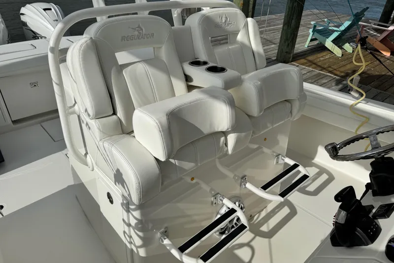 Slide: The Image of 2022 Regulator 34 boat interior with cup holders and storage compartments. - 35