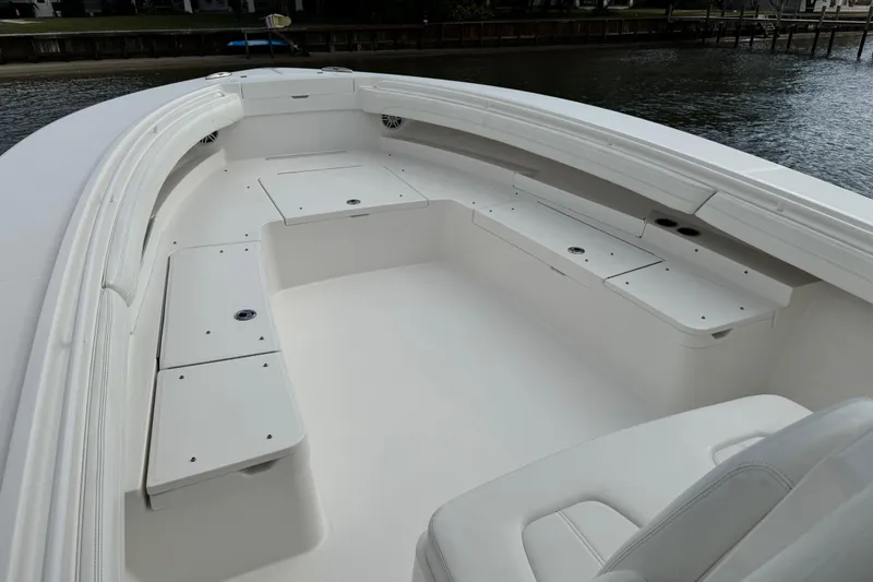 Slide: The Image of 2022 Regulator 34 boat with Garmin radar system on the roof, under cloudy sky. - 38