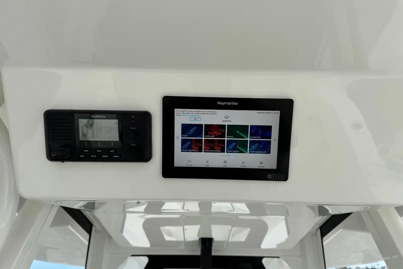 Slide: The Image of 2022 Regulator 34 boat, close-up of cabin and model number, docked by the water. - 42