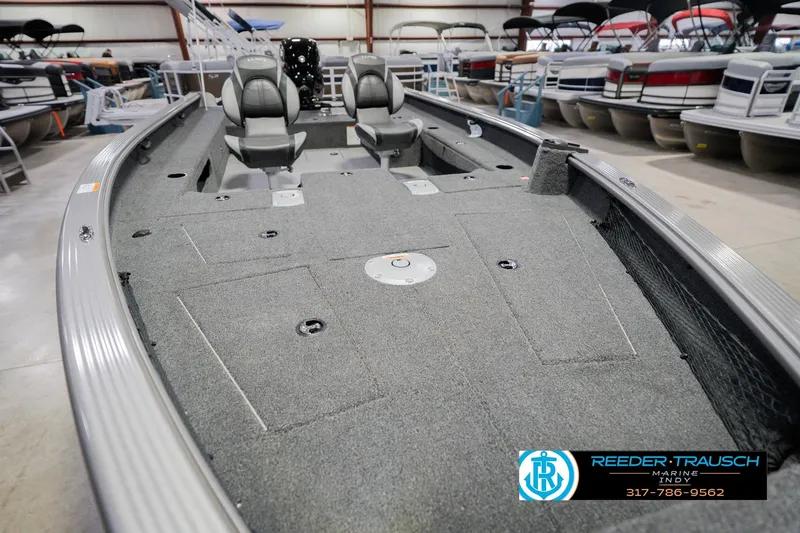 Slide: The Image of 2026 Lund 1875 Pro Guide boat interior with seating and storage compartments. - 10