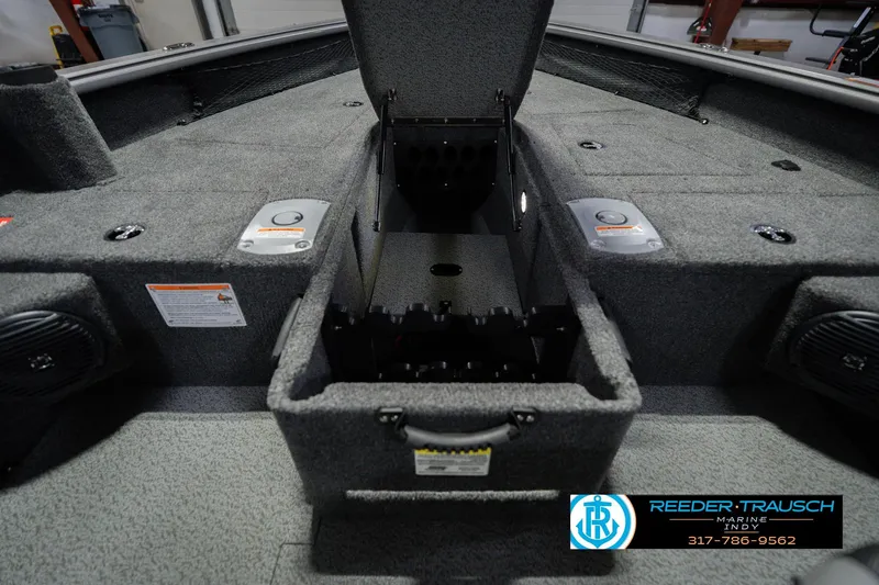 Slide: The Image of 2026 Lund 1875 Pro Guide boat interior with storage compartments and speakers. - 29