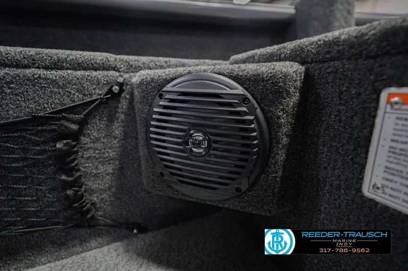 Slide: The Image of 2026 Lund 1875 Pro Guide boat interior with speaker and storage netting. - 38