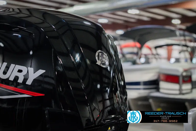 Slide: The Image of 2026 Lund 1875 Pro Guide boat with Mercury engine in showroom. - 44