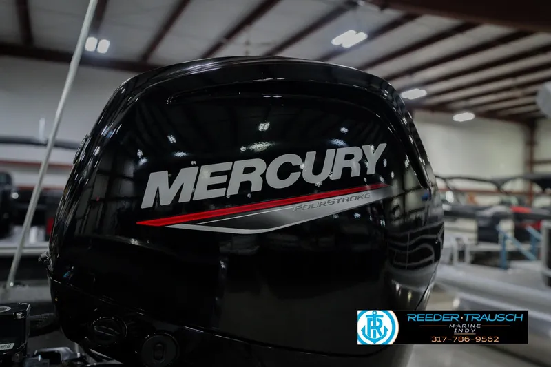 Slide: The Image of 2026 Lund 1875 Pro Guide with Mercury FourStroke engine in a showroom. - 45