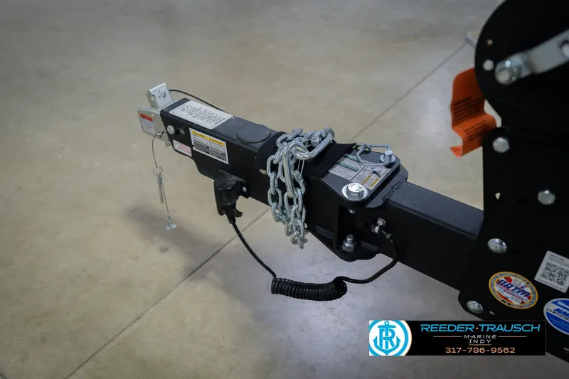Slide: The Image of Trailer hitch of 2026 Lund 1875 Pro Guide boat, secured with chains. - 58