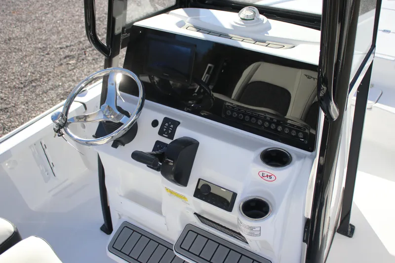 Slide: The Image of 2026 Tidewater 2110 Bay Max boat console with steering wheel and controls. - 15