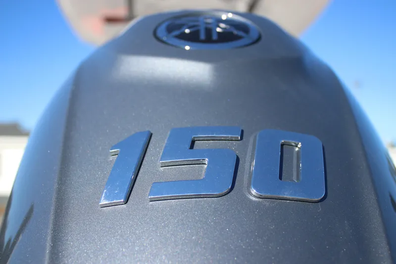 Slide: The Image of Close-up of a 150 horsepower engine on a 2026 Tidewater 2110 Bay Max boat. - 23