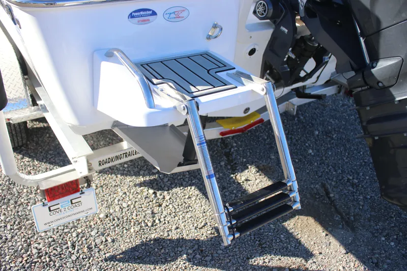 Slide: The Image of 2026 Tidewater 2110 Bay Max boat with foldable swim ladder and Yamaha engine. - 6