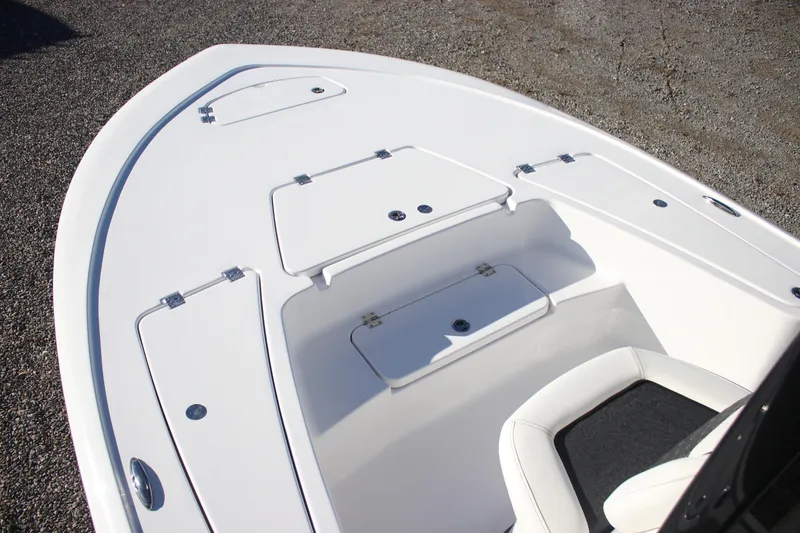 Slide: The Image of 2026 Tidewater 2110 Bay Max boat deck with storage compartments. - 7