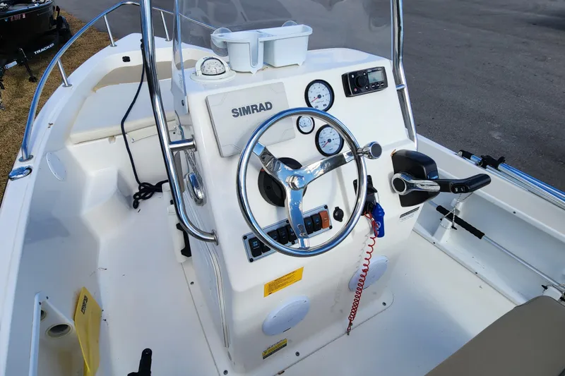 Slide: The Image of 2017 Key West 1720 Center Console boat interior with steering wheel and controls. - 10
