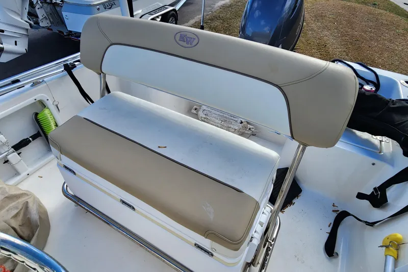 Slide: The Image of 2017 Key West 1720 Center Console boat seat with beige and white upholstery. - 13