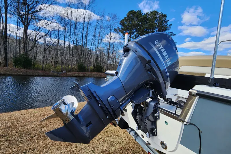 Slide: The Image of 2017 Key West 1720 Center Console with Yamaha outboard motor by a serene lake. - 3