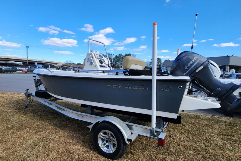 Slide: The Image of 2017 Key West 1720 Center Console boat on trailer, featuring Yamaha outboard motor. - 6