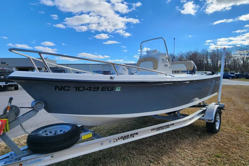 Slide: The Image of 2017 Key West 1720 Center Console boat on trailer under blue sky. - 8