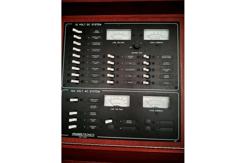 Slide: The Image of Electrical panel of a 1986 Crealock 40 sailboat, featuring 12V DC and 120V AC systems. - 15