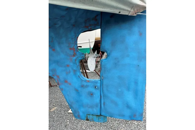 Slide: The Image of Blue rudder of a 1986 Crealock 40 sailboat with visible propeller. - 26