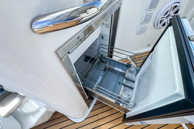 Slide: The Image of Open refrigerator on 2026 Wellcraft 38 T-Top boat, showcasing modern design and functionality. - 14