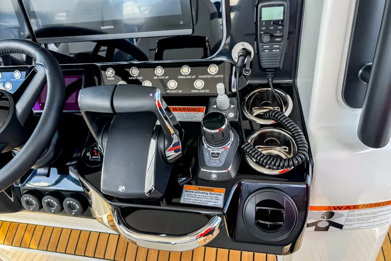 Slide: The Image of Control panel of 2026 Wellcraft 38 T-Top boat with advanced navigation and communication systems. - 22