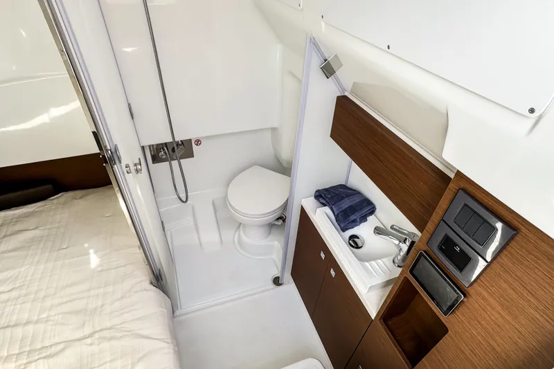 Slide: The Image of Modern bathroom in 2026 Wellcraft 38 T-Top boat, featuring sleek design and compact amenities. - 24