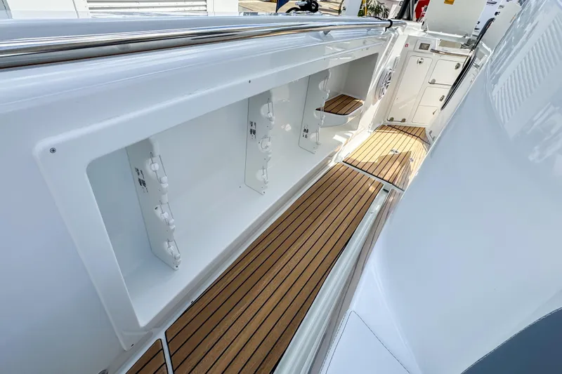 Slide: The Image of 2026 Wellcraft 38 T-Top boat interior with sleek design and wooden flooring. - 31
