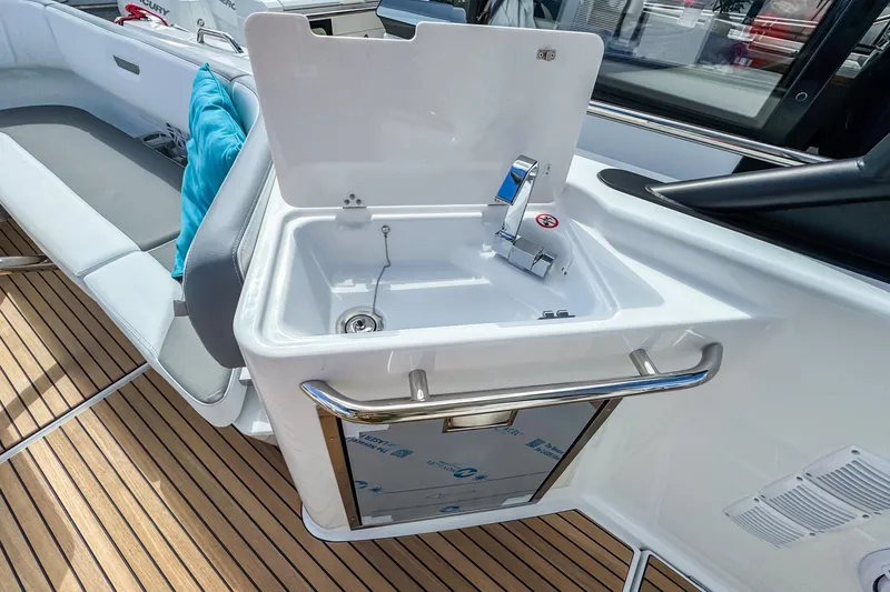 Slide: The Image of 2026 Wellcraft 38 T-Top boat with sleek sink and modern deck design. - 13