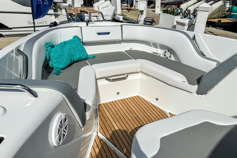 Slide: The Image of Luxurious seating area on 2026 Wellcraft 38 T-Top boat with teal cushion and wood flooring. - 26