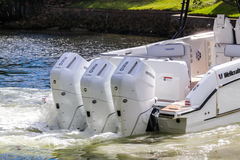 Slide: The Image of 2026 Wellcraft 38 T-Top boat with triple Mercury outboard engines on water. - 4