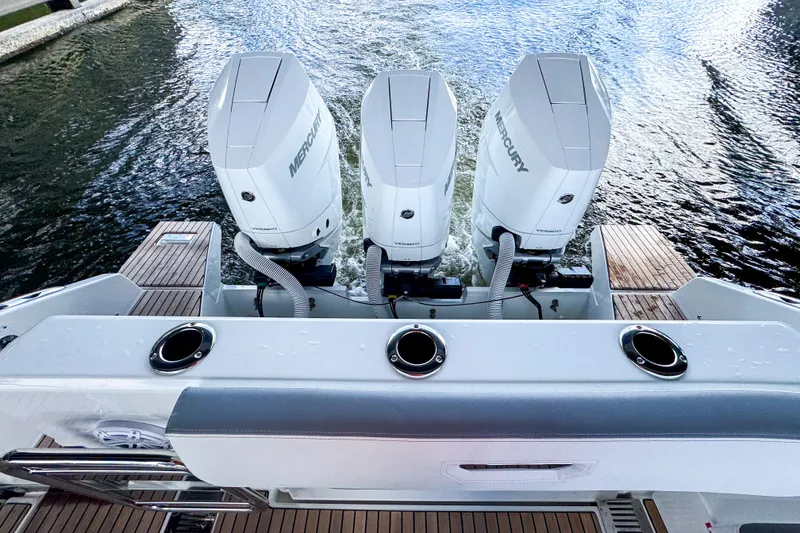 Slide: The Image of 2026 Wellcraft 38 T-Top boat with triple Mercury outboard engines on water. - 8