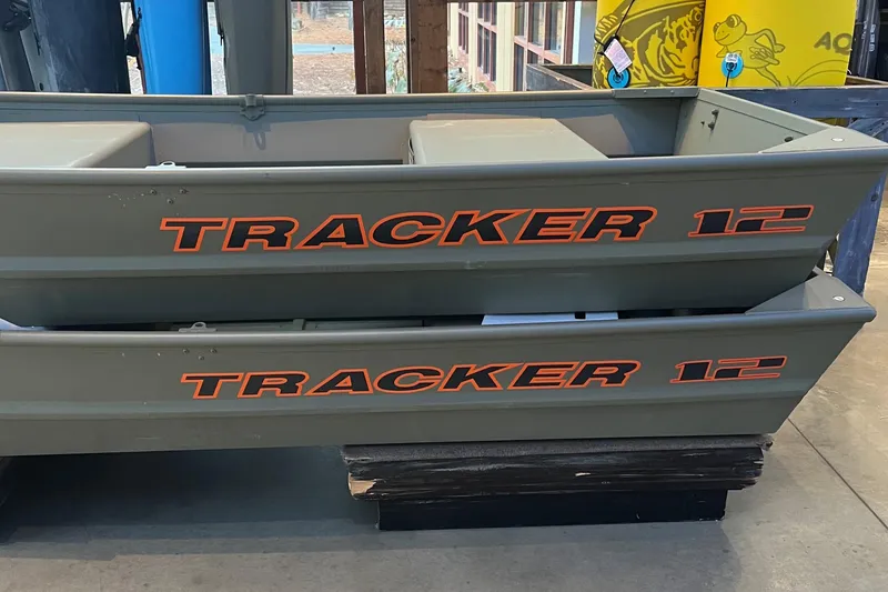 The Image of 2026 Tracker Grizzly 12 Jon boat, stacked display in showroom. - 0
