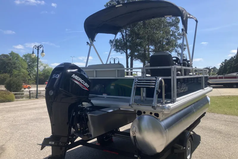Slide: The Image of 2026 Sun Tracker Bass Buggy 16 XL Select pontoon boat with Mercury 50 engine. - 3