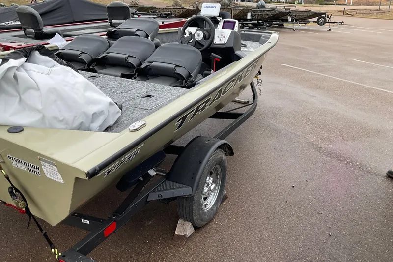 Slide: The Image of 2026 Tracker Pro Team 175 Crappie Edition boat on trailer in parking lot. - 4