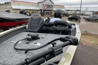 Slide: The Image of 2026 Tracker Pro Team 175 Crappie Edition boat parked near Tractor Supply store. - 59